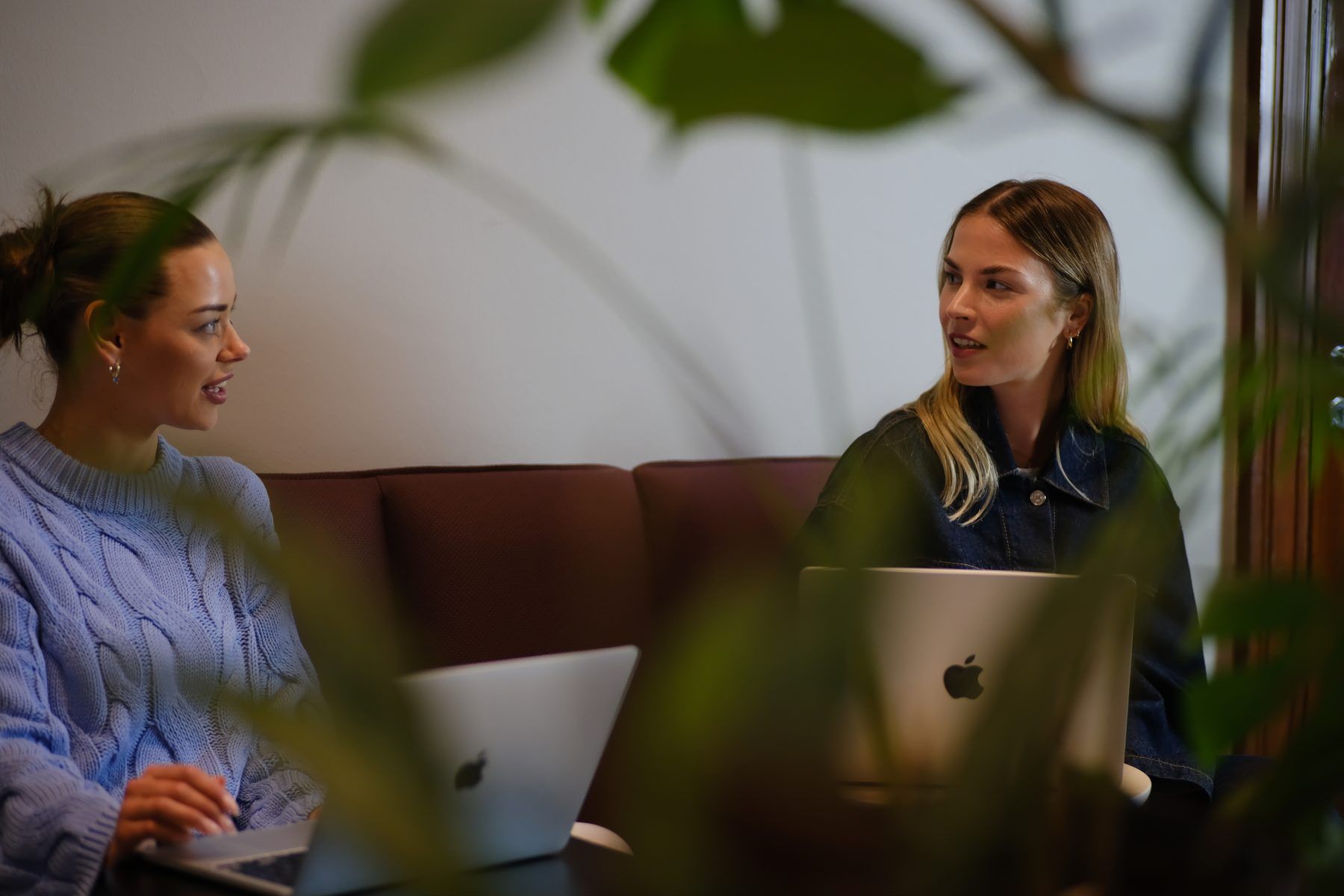 Two people discussing lead campaign planning on a couch