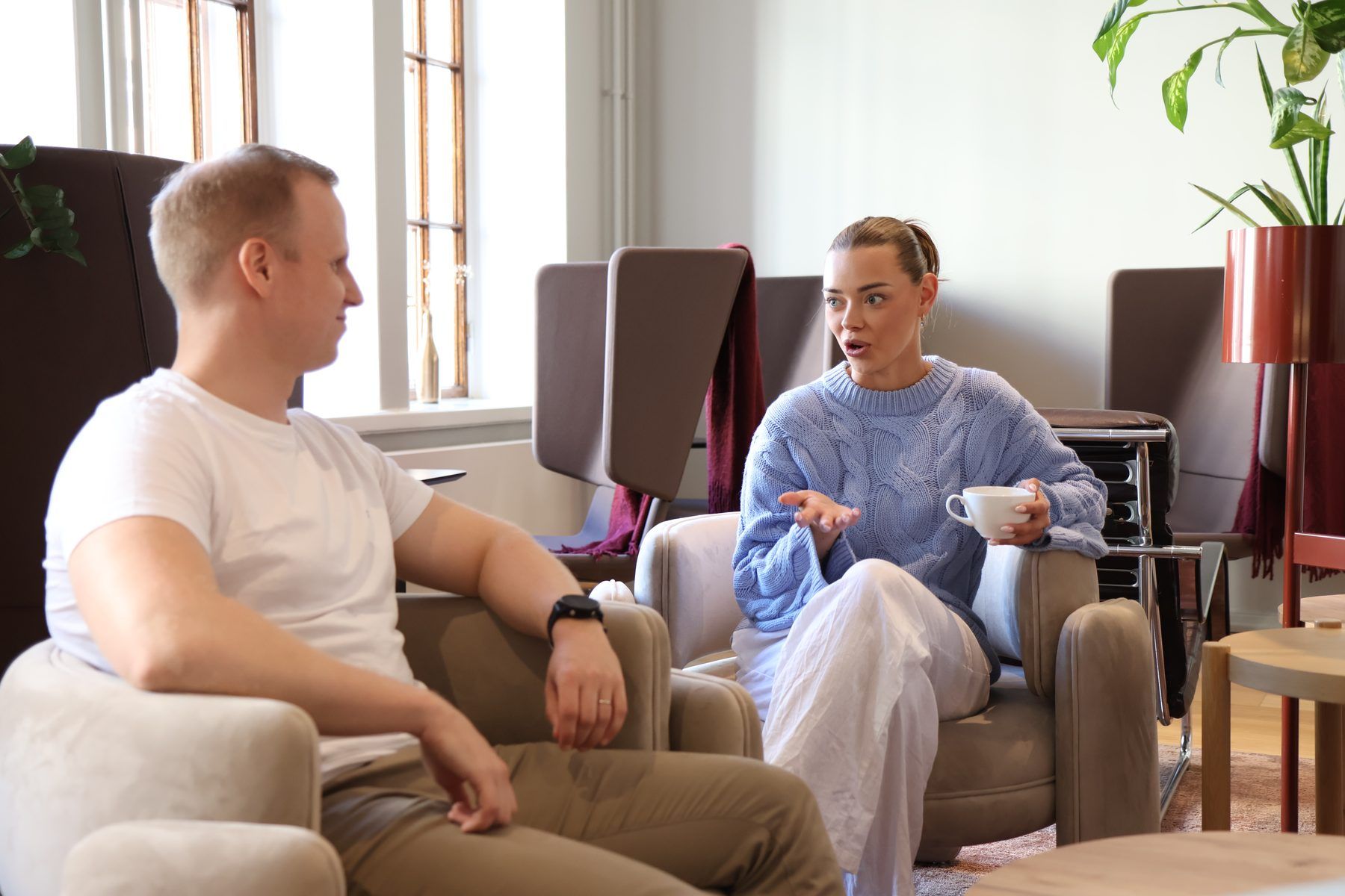 Two specialists planning social advertising together in a lounge