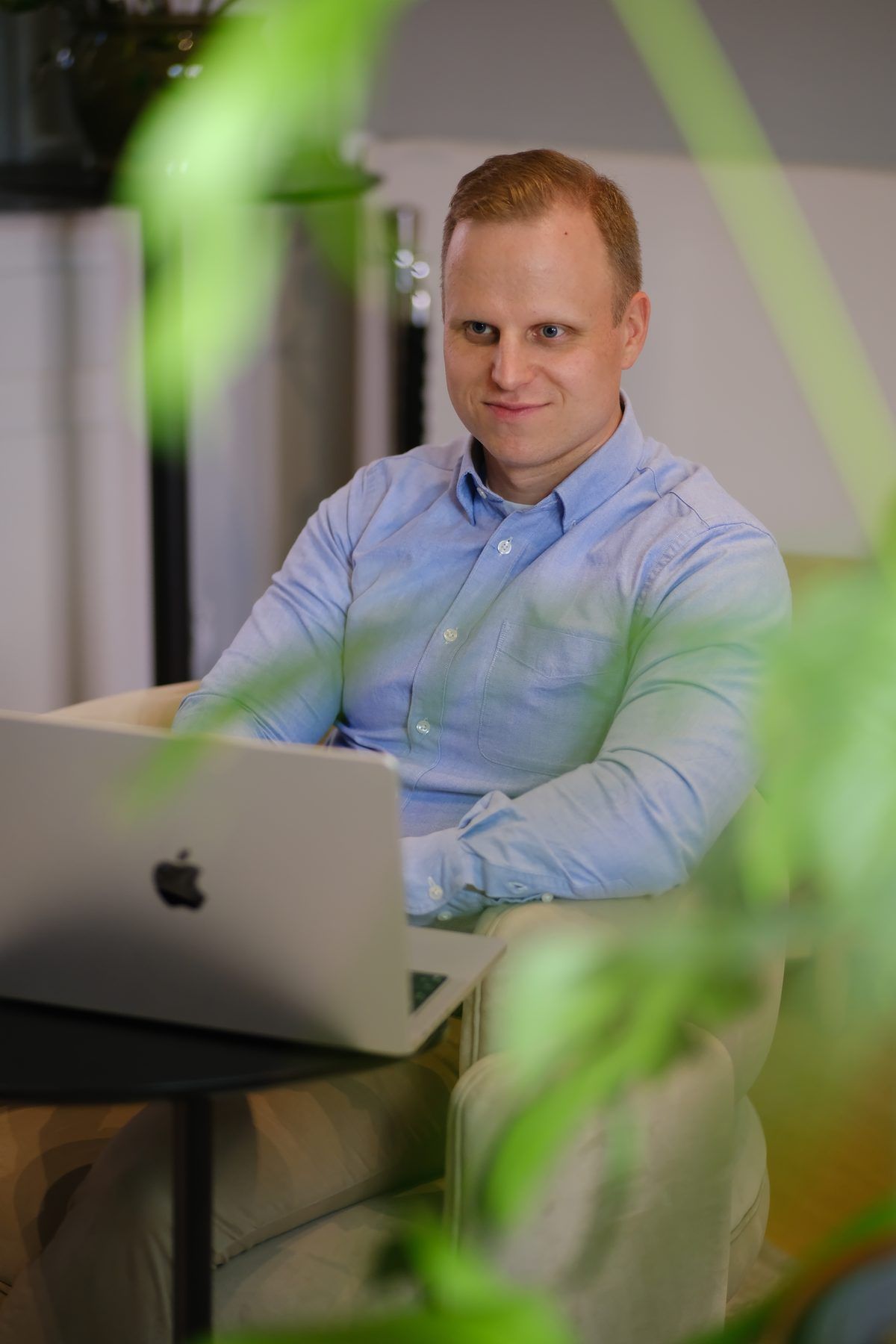 A specialist reviewing advertising numbers on a laptop